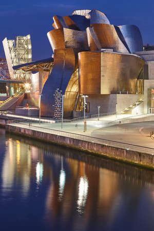 Bilbao downtown Guggenheim museum titanium metallic facade by night. Spainのeditorial素材