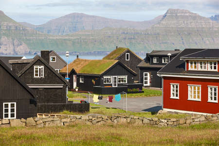 Traditional faroe islands rural village located on a fjord. Europeの写真素材