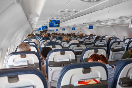 Airplane interior with seats and display with gps. Comercial flightの写真素材