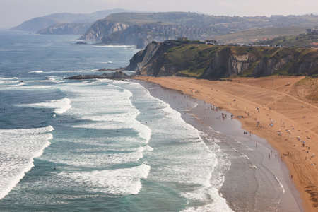 Spanish sandy coastline with surfers. Sopelana, Basque country, Spainの写真素材