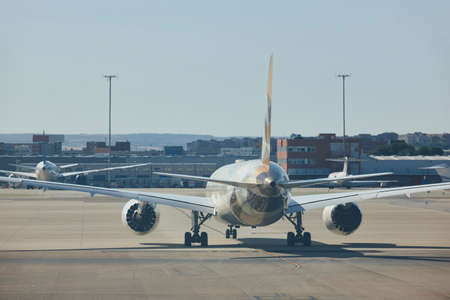 Comercial airplane in the runway. Transportation and tourism industry. Journey