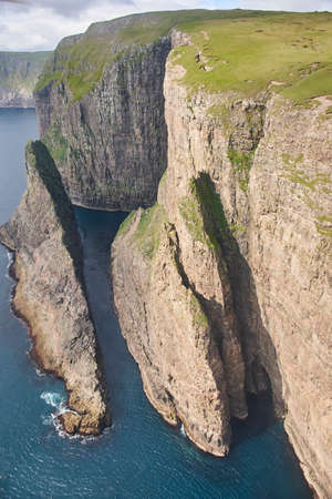 Faroe islands dramatic coastline viewed from helicopter. Vagar areaの写真素材