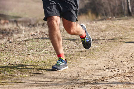 Cross country runner on a race. Active healthy outdoor lifestyle
