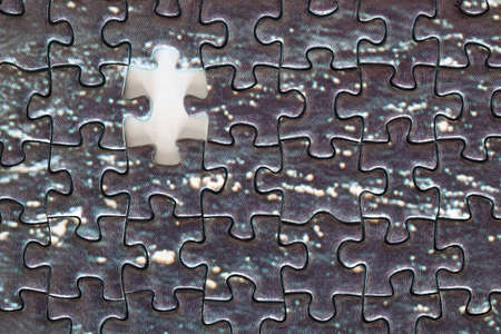 Jigsaw pieces detail. Unfinished puzzle. Missing pieceの写真素材