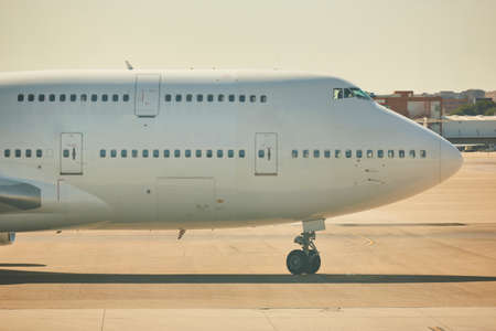 Huge airplane in the runway. Transportation and tourism industry. Journey