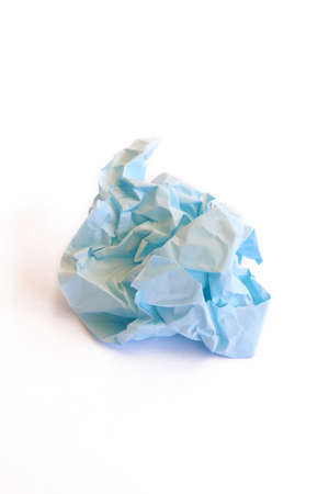 Crumpled blue paper isolated on white. Verticalの写真素材