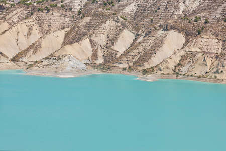 Badlands landscape and blue waters in Algeciras reservoir. Murcia, Spain