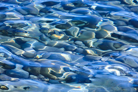 Pebble stone reflections on the water. Nature background. Zen meditation