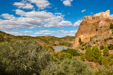 Picturesque village with medieval castle on top of the hill.のeditorial素材