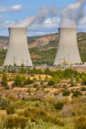Nuclear power plant chimneys with steam. Sustainable energy