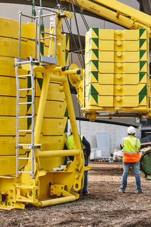 Workers on a construction site. Engineering and architectural infrastructure. Workplace