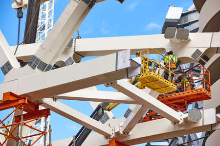 Workers on a construction site. Engineering and architectural infrastructure. Workplace