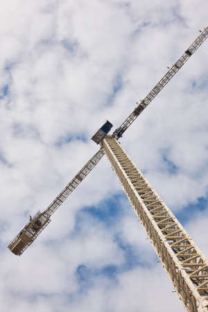 Telescopic crane under a white sky. Construction engineering industryの写真素材