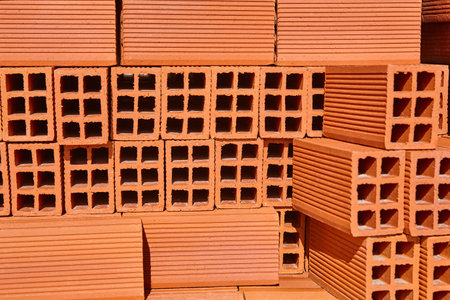 Stacked block bricks. Construction industry material. Brickwork masonry. Architecture