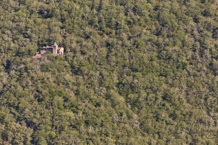 Romanesque monastery sorrounded by forest and river. Ribeira sacra. Spain