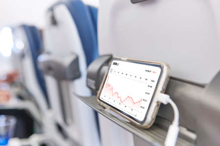 Airplane cabin interior with mobile phone charging batteries. Businessの写真素材