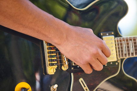 Man playing electric guitar detail. Musician. Musical instrument. Hobby