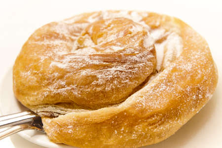 Traditional spanish bakery pastry dessert, ensaimada. Mallorca dessert. Balearic islands