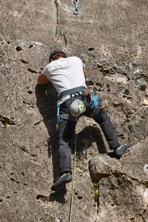 Climber on a granite wall. Extreme sport. Outdoor mountain activity