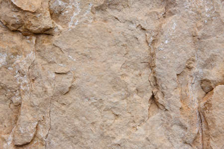 Natural stone background detail in warm tone. Textureの写真素材