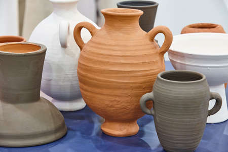Handcrafted pottery jars in diferent colors. Still life. Decorativeの写真素材