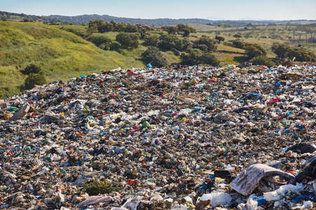 Open air garbage dump. Plastic pollution. Recycling junk. Consumerism