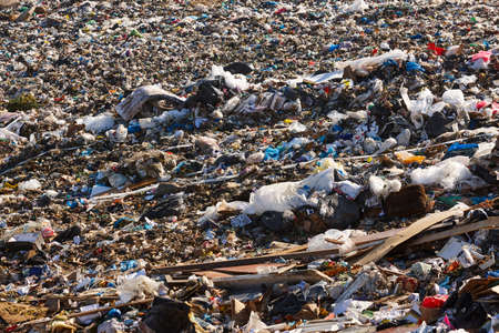 Open air garbage dump. Plastic pollution. Recycling junk. Consumerismの写真素材