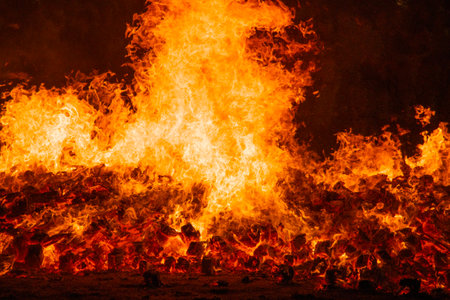 Fire by night. Flames and embers. Hell and infernoの写真素材
