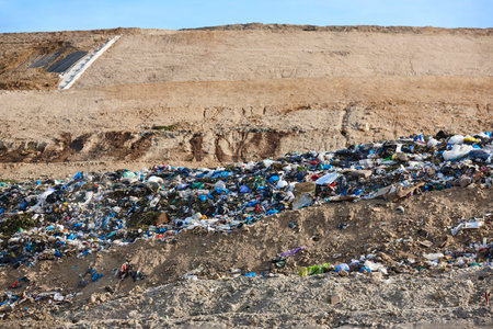 Open air garbage dump. Plastic pollution. Recycling junk. Consumerism