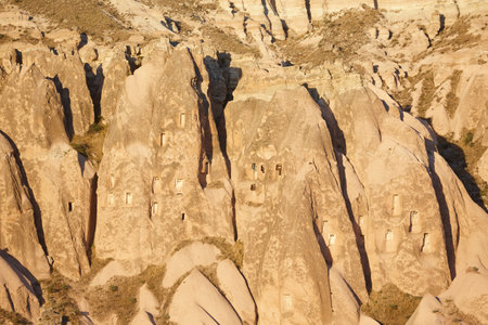 Picturesque troglodyte dwellings in Cappadocia valley. Goreme, Turkeyの写真素材