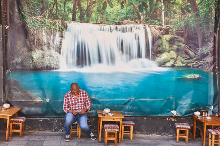 Picturesque tea house in Istanbul. Man enjoying his tea. Istanbulの写真素材
