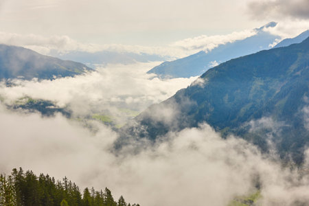 Cloudy mountain and valley landscape in Salzburg region. Hiking Austriaの写真素材