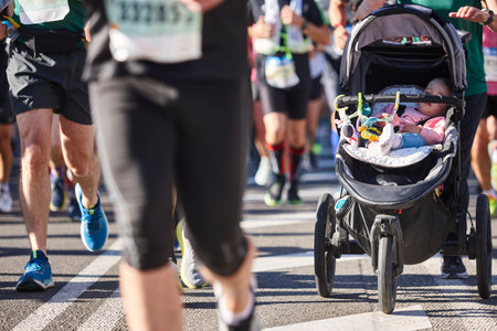 Runners and baby on the street. Healthy lifestyle. Active peopleの写真素材