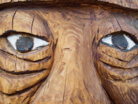 Funny handcrafted woodwork. Head detail. Eyes. Carpentryの写真素材