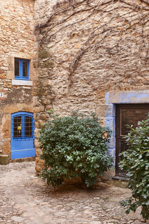 Picturesque medieval village of Peratallada. Blue doors. Girona, Catalunya. Spainの写真素材