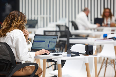 Professional business woman working on a coworking area. Corporate employee