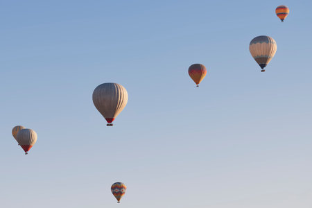 Spectacular balloons flying at sunrise in Goreme valley. Cappadocia, Turkeyの写真素材
