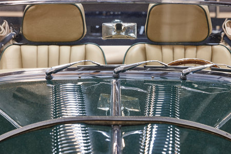 Classic car front part detail in green tone. Horizontal
