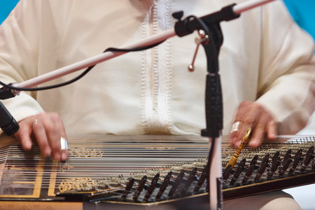 Traditional moroccan musician with wooden string instrument. Qanunの写真素材