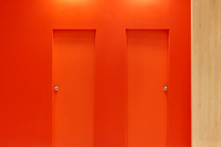 Wall and two doors in orange color. Contemporary design interior.の写真素材