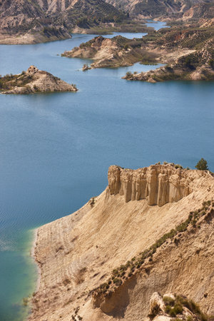 Badlands landscape and blue waters in Algeciras reservoir. Murcia, Spainの写真素材