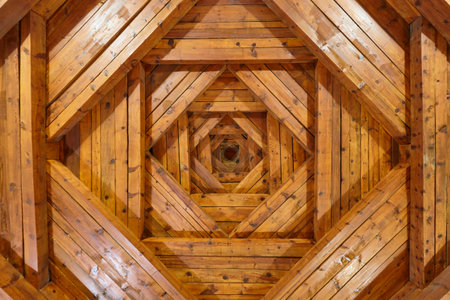 Coffered ceiling finished in wood. Interior design craftmanship. Construction industryの写真素材