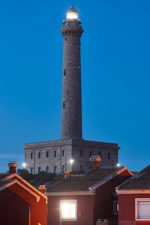 Cabo de Palos stone lighthouse at sunset. Murcia, Spainの写真素材