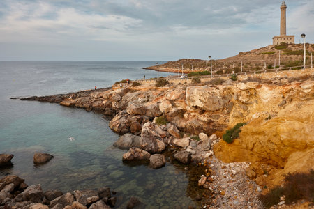 Cabo de Palos stone lighthouse at sunset. Murcia, Spainの写真素材