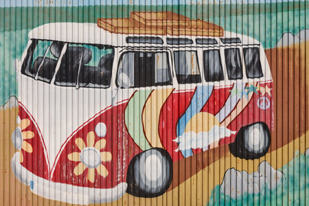 Classic vintage van. Graffiti painted parking door. Recreational vehicle. Wanderlust