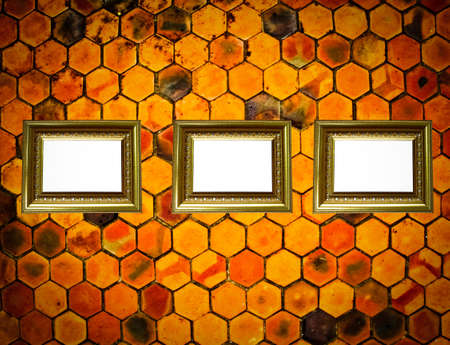 Gold frame on tile grunge backgroundの写真素材