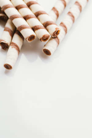 wafer rolls with nut filling on a light mirror background.の写真素材