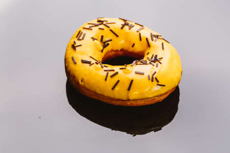 Fresh delicious donuts with banana cream on a dark background.の写真素材