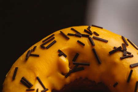 Fresh delicious donuts with banana cream on a dark background.の写真素材