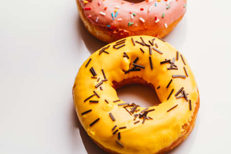 Fresh donut with strawberry and banana cream on a white background.の写真素材